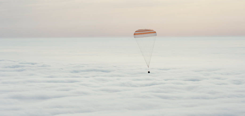 The Soyuz TMA-18M carrying Scott Kelly, Mikhail Kornienko and Sergey Volkov drifts safely back to Earth. (Image by NASA/Bill Ingalls)